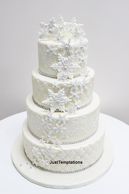 white wedding cake with snowflakes