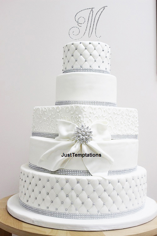 white wedding cake with pearl details