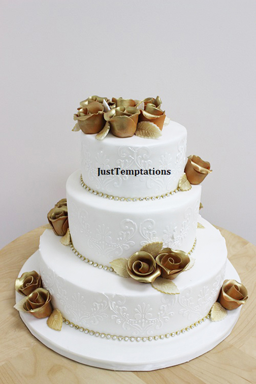 white cake with gold flowers