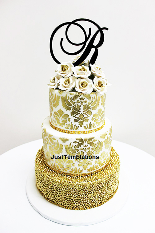 gold confetti 3 tiered wedding cake