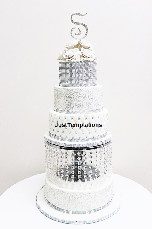 silver and white wedding cake with pearls