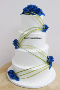 blue floral and white wedding cake