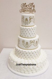 5 tiered white and gold wedding cake