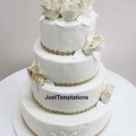 cream wedding cake with gold details