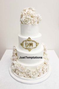4 tiered wedding cake with flowers