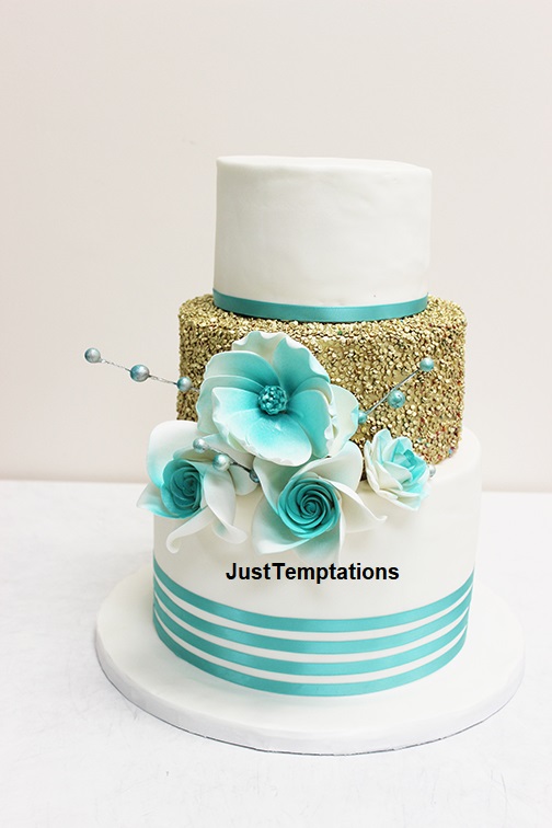 gold confetti and blue wedding cake