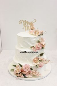 butter cream 3 tiered floral wedding cake