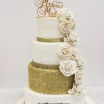 gold confetti and cream floral wedding cake