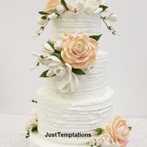 peach and white 4 tiered wedding cake