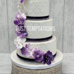 white and purple cascading floral wedding cake