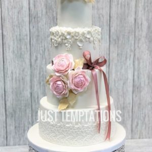 cute engraved floral white and pink wedding cake